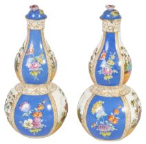 A PAIR OF LATE 19TH CENTURY DRESDEN TYPE AUGUSTUS REX TAPERING DOUBLE GOURD BOTTLE VASES AND COVERS