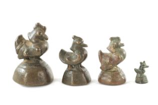 A SET OF FOUR 18TH/19TH CENTURY GRADUATED BRONZE OPIUM WEIGHTS