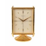 A JAEGER-LECOULTRE GILT BRASS DESK ALARM CLOCK