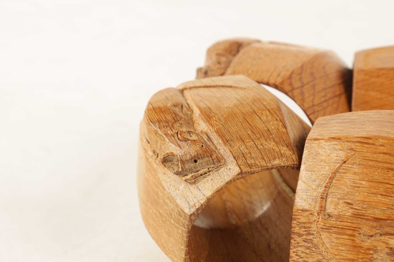 A GOOD SET OF SIX ROBERT 'MOUSEMAN' THOMPSON LIGHT OAK AND SLIGHTLY AZED SERVIETTE RINGS - Image 4 of 5