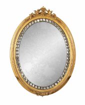 A 19TH CENTURY IRISH GILT GESSO AND MOSAIC MIRRORED GLASS OVAL HANGING MIRROR