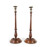 A LARGE PAIR OF LATE 19TH CENTURY TURNED MAHOGANY CANDLESTICKS