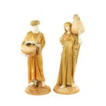 A LARGE PAIR OF ROYAL WORCESTER STANDING FIGURES OF EASTERN WATER CARRIERS AFTER JAMES HADLEY