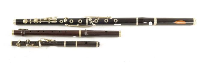 A COLLECTION OF THREE WOODEN FLUTES