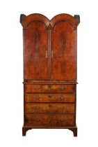 A WILLIAM AND MARY HERRINGBONE BANDED FIGURED WALNUT DOUBLE DOME TOP SECRETAIRE CABINET