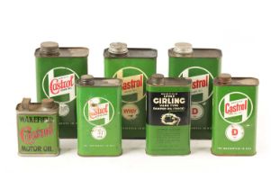 A COLLECTION OF SEVEN CASTROL OIL CANS