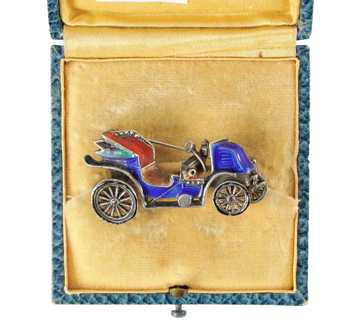 A VINTAGE SILVER ENAMEL CAR BROOCH