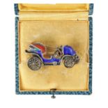 A VINTAGE SILVER ENAMEL CAR BROOCH