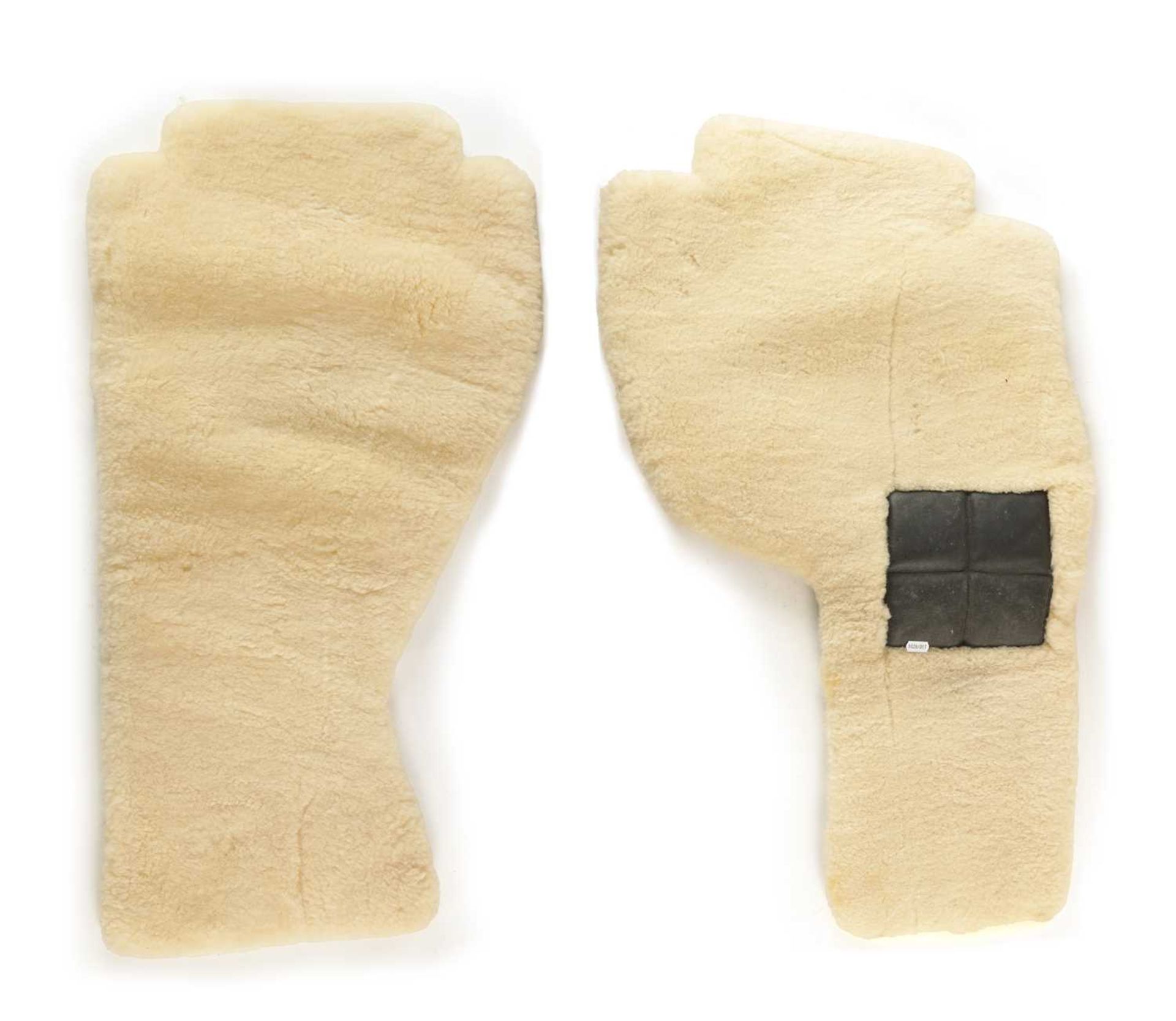 TWO SHEEPSKIN FOOTWELL MATS POSSIBLY FOR A FERRARI