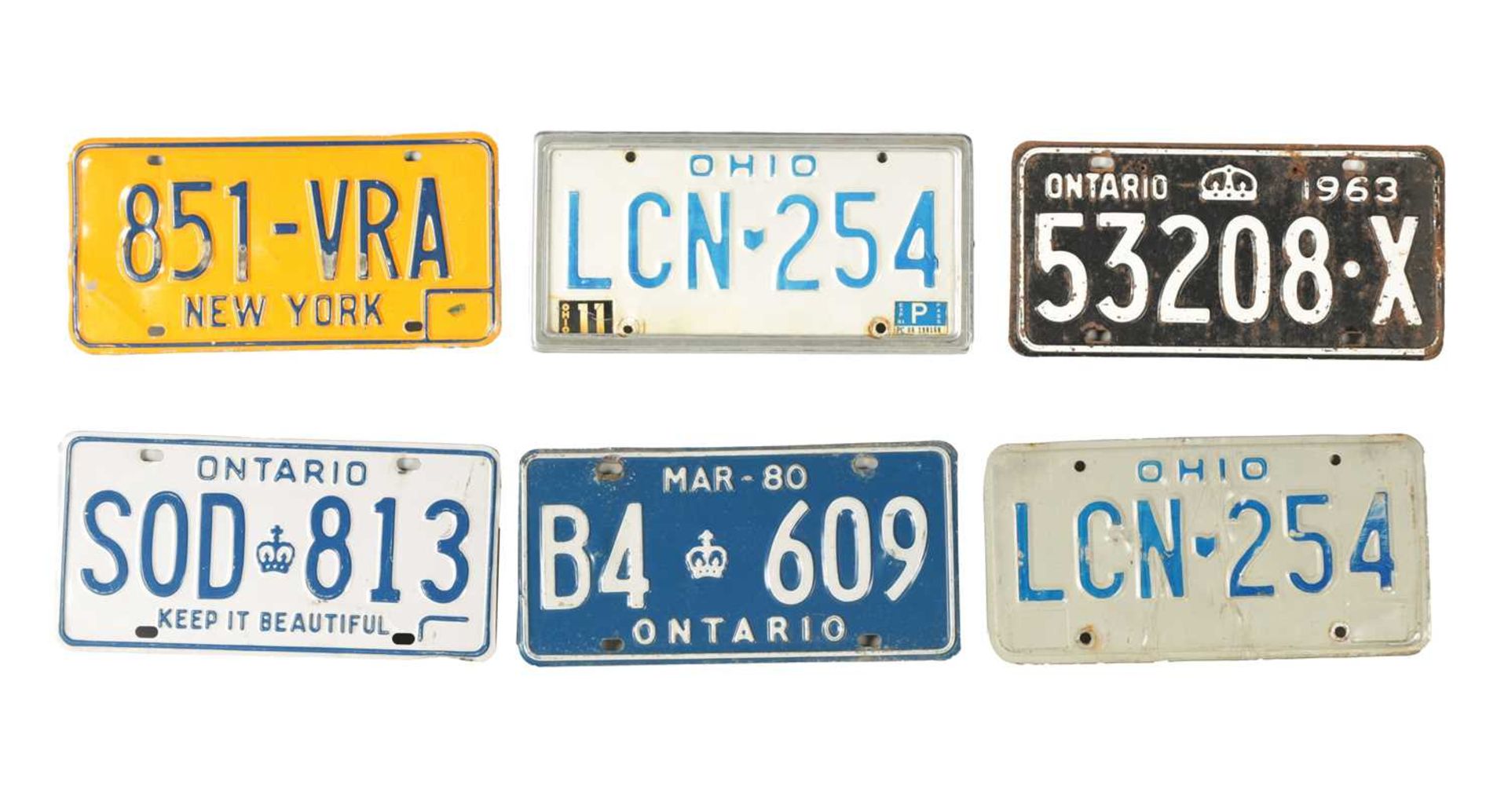 A COLLECTION OF UNITED STATES AND CANADIAN NUMBER PLATES