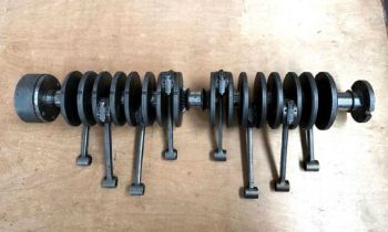 AN EIGHT CYLINDER CRANKSHAFT POSSIBLY OFF A BUGATTI