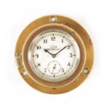 AN EARLY 20TH CENTURY STADIUM 8-DAY BRASS CASED CAR CLOCK