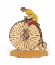 A RARE 19TH CENTURY CAST IRON PAINTED DOORSTOP FORMED AS A CYCLIST MOUNTED ON A PENNY FARTHING