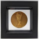A 1994 FIFA World Cup participation Medal. The obverse of the Medal features a high relief etching