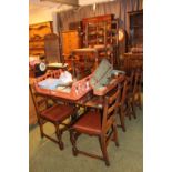 Oak Draw leaf table on carved bulbous legs and a set of 8 Ladder back chairs