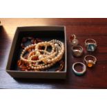 Collection of assorted Silver Rings, Amber Necklace and a Faux Pearl Necklace