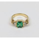 Fine Ladies Square Cut Columbian Emerald claw set ring with Trilliant Cut shoulders. Central Emerald