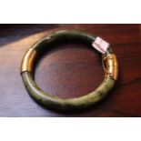 Chinese Jade Bangle with Gilt Metal fittings and chain