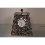 Silver plated mantel clock with Roman numeral dial and applied polished stone
