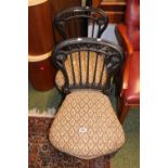 Pair of Ebonised Victorian Nursing chairs with upholstered seats over caster feet