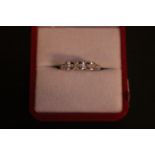 Ladies 18ct White Gold Diamond set ring with Baguette channel set stones. 3.4g total weight. Size N