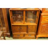 Good quality Japanese Tansu type Cabinet with Glazed front and sliding cupboard and drawer base