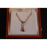 Ladies 9ct Gold Triangular Pink Tourmaline set on curved bar with claw set Diamond with chain 2.4g