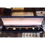 Ladies 9ct Gold round belcher link bracelet with trigger clasp and enamelled Handbag charms 9.4g