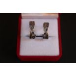 Pair of 9ct White Gold crossover earrings set with Diamonds & Sapphires 4.4g total weight