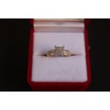 Good quality Ladies Diamond set ring with Diamond set shoulders of Brilliant cuts with Princess