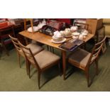 Mid 20thC Teak extending dining table and a set of 6 chairs with upholstered seats