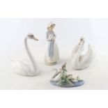 2 Lladro Swans, Lladro Swan and cygnets and a Nao figure of a woman with Puppy