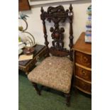 Early 19thC Carved back oak chair of foliate and fluted design