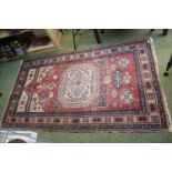 Persian Rug of red ground with central medallion 204 x 120cm
