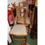 Pair of Edwardian Walnut chairs with carved backs and upholstered seats