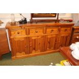 Heavy Long Pine sideboard of 4 drawers above cupboard base
