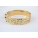 Ladies 9ct Gold Plated engraved Bangle of floral engraved decoration with safety chain