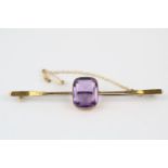 Impressive Ladies Yellow gold bar brooch with inset rectangular facetted amethyst 6.6g total weight