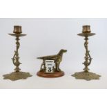 Pair of Brass candlesticks by William Tonks & Son with foliate decoration and a Brass Hunting dog