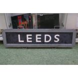Railwayana; Railway handheld sign for Leeds with wooden and metal frame. 107cm in Length