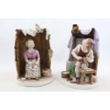 Pair of 19thC Pottery seated figures of a Cobbler and Seamstress with barrel formed back 23cm in