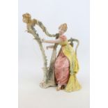 European Bisque porcelain figure of a woman playing a Harp with scrolled mark to base and Arrow blue