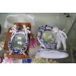 European Dresden Oval cherub decorated mirror and another similar mirror