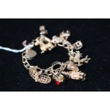 Ladies 9ct Gold Charm Bracelet with assorted Charms 40g total weight