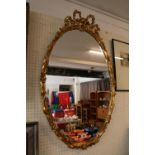 Large Oval Gilt Gesso type wall mirror