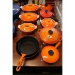 Collection of Orange Le Creuset graduated Casserole & other pans