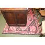 Red Ground Pakistan rug with geometric design