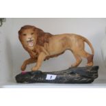 Beswick porcelain figure of a Lion on rocky outcrop