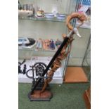 Cast Iron Stick Stand with drip tray, Mallard handled stick and a African carved Stick