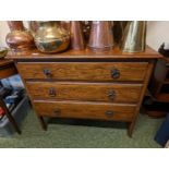 Oak chest of 3 drawers with metal drop handles on straight supports and casters
